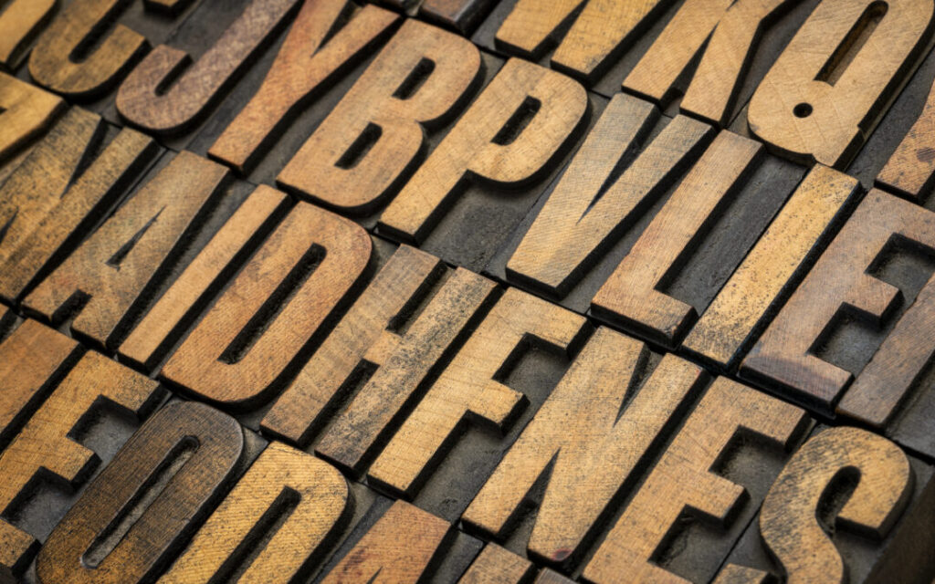 background of random vintage letterpress wood type printing bloc